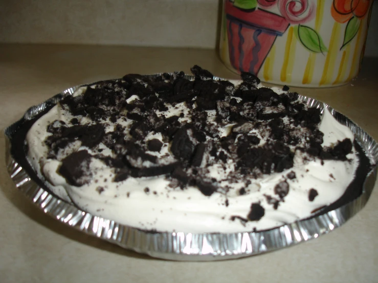 a cake with oreo cookie on top of it