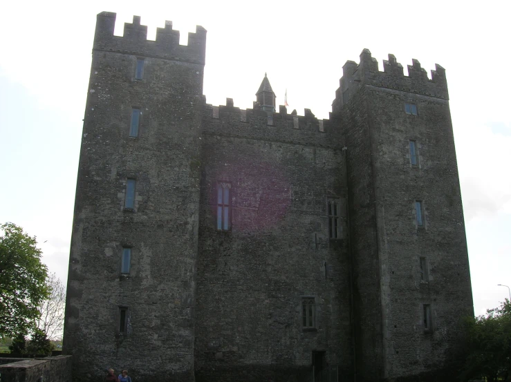 a stone castle that looks like it's on a nice day