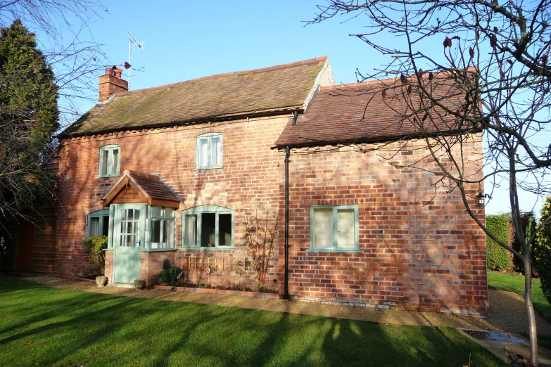 a house with two windows on a sunny day