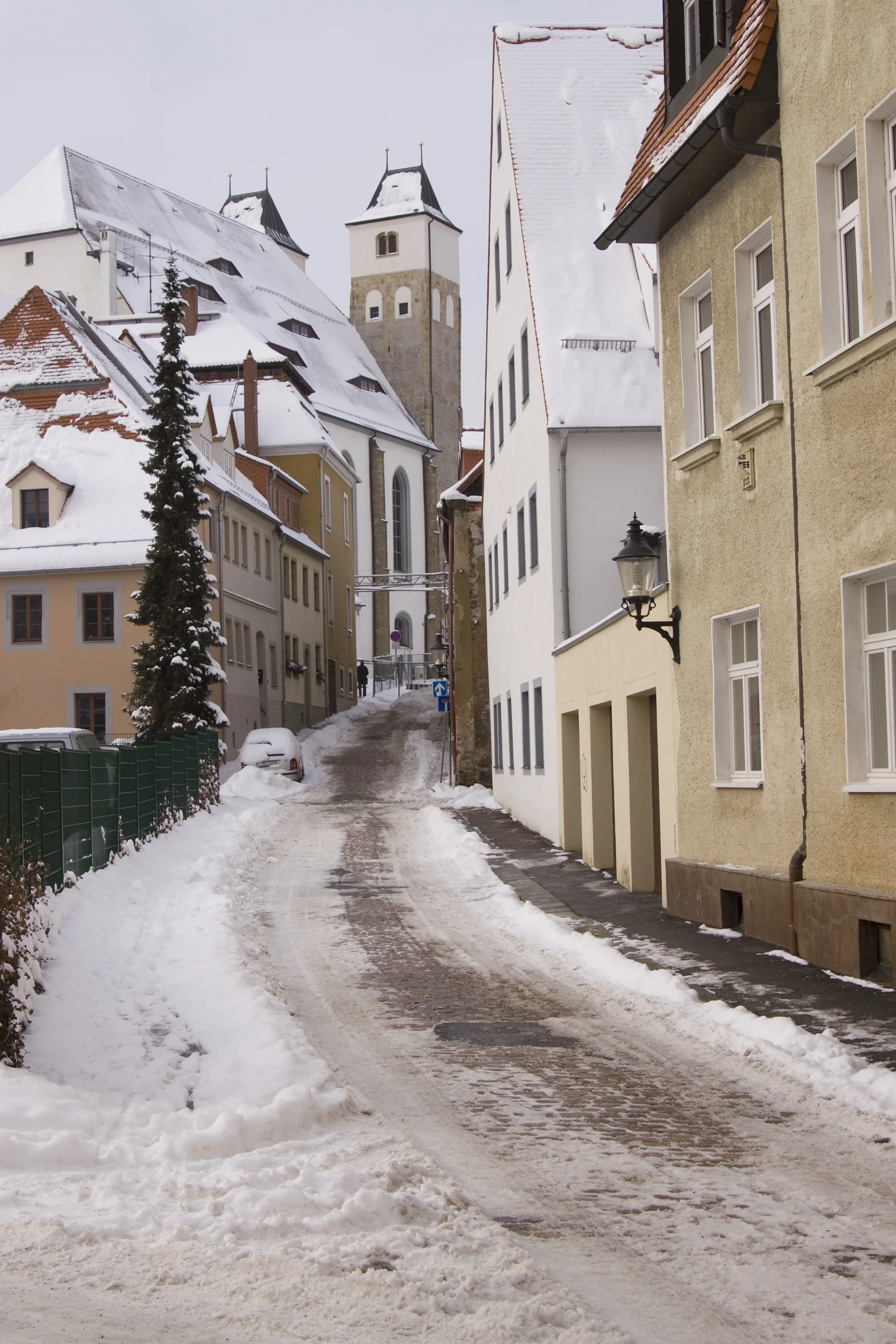 street scene with buildings with snow on the ground