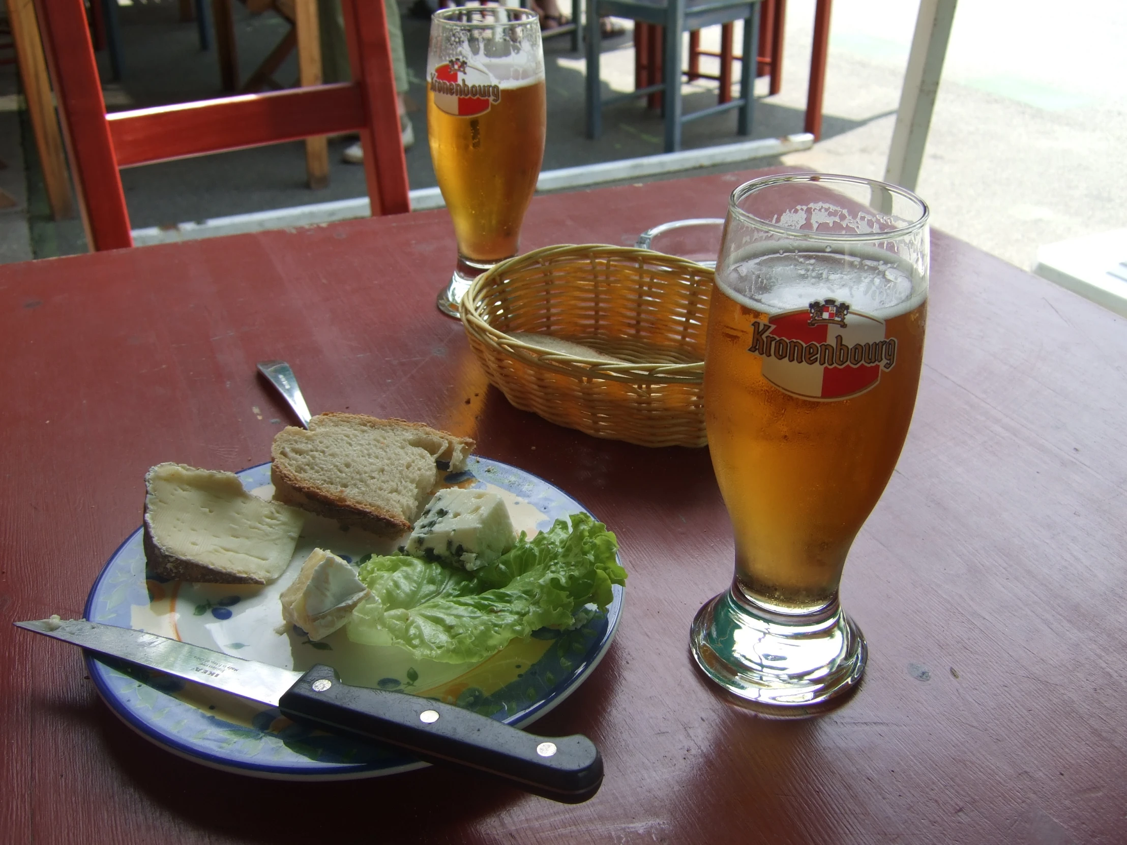 a meal with beer on a red table