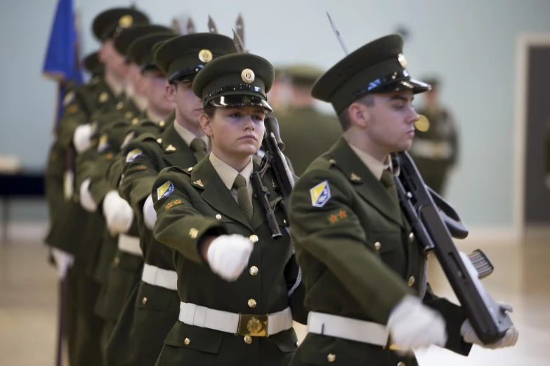 a group of men dressed in uniforms with guns