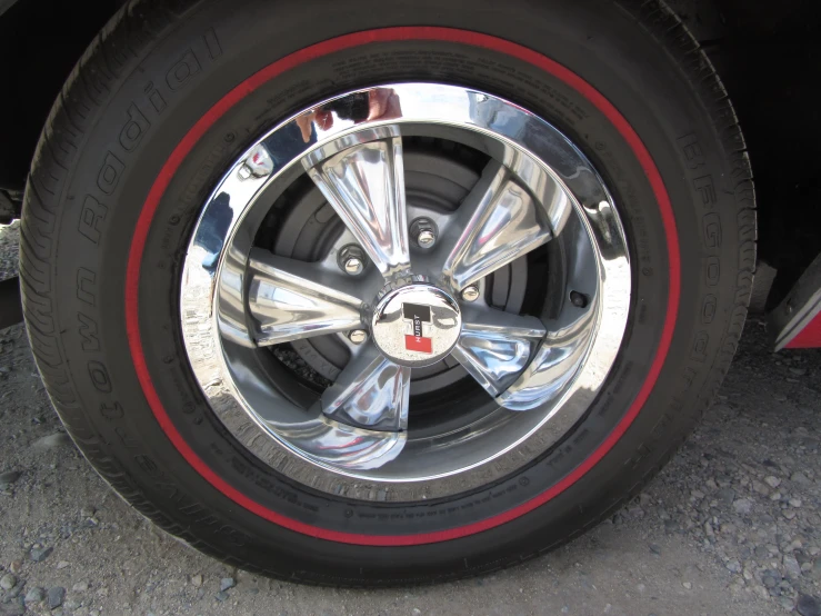 tire and red stripes on the wheel of a vehicle