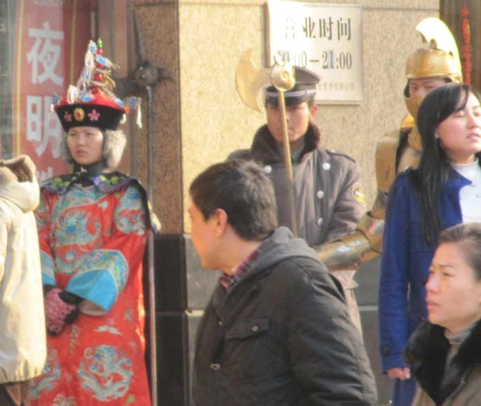 there is a woman in costume standing next to a man