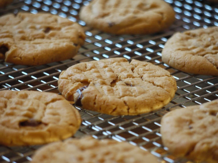 a pile of cookie cookies are on a wire rack