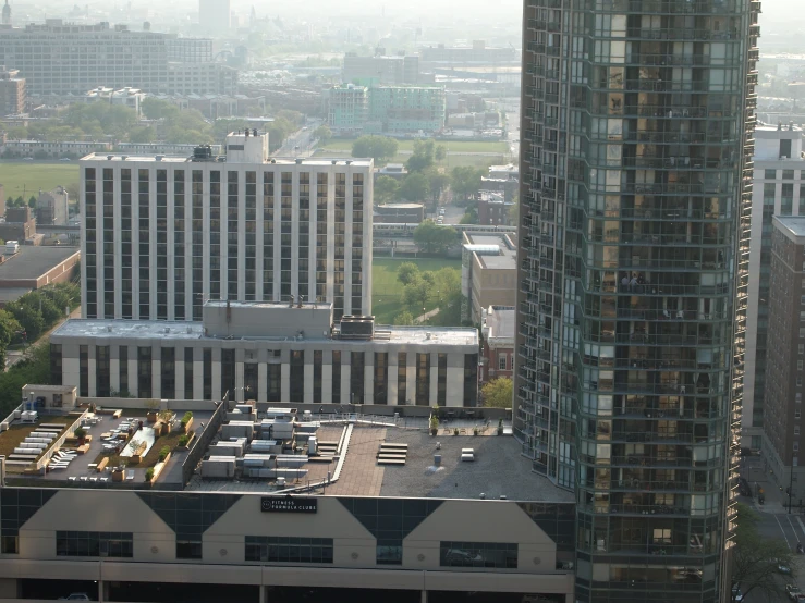 a tall building surrounded by other large buildings