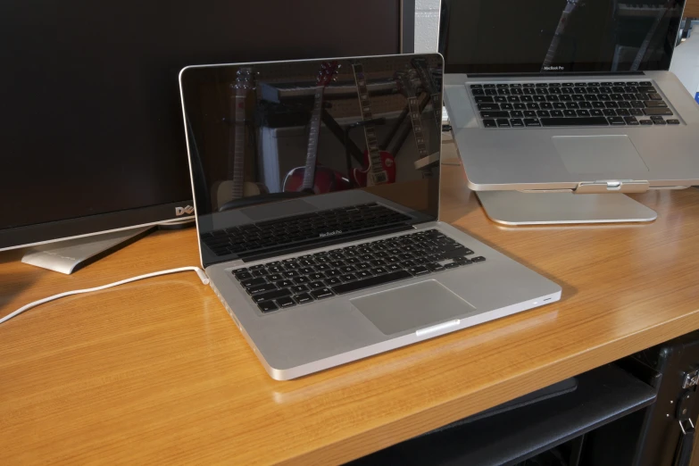 an image of two laptops on a desk