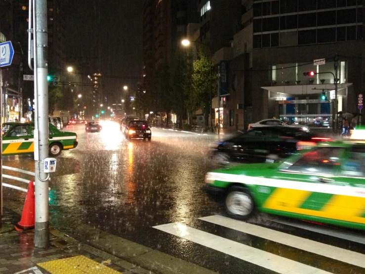 a busy street filled with traffic at night