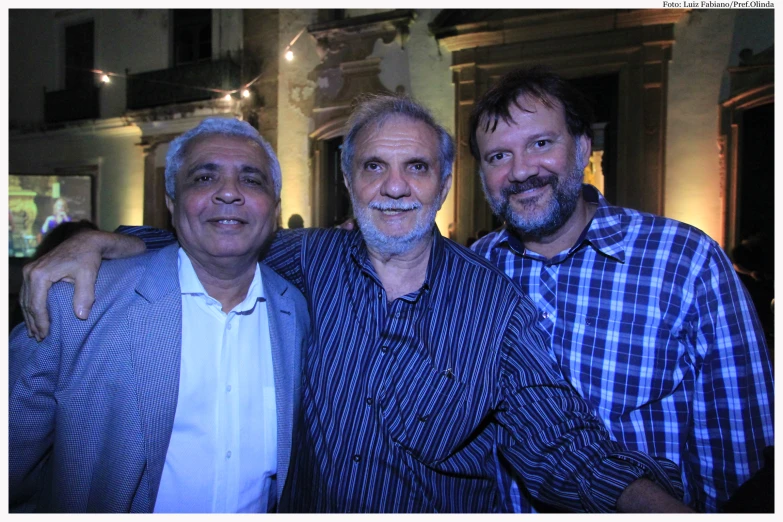 two men with beards standing next to each other