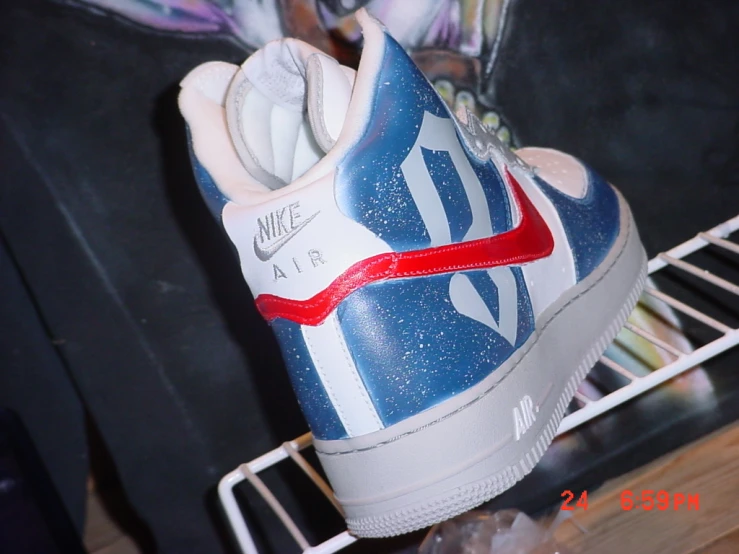 blue and white nike air force sneakers are on display