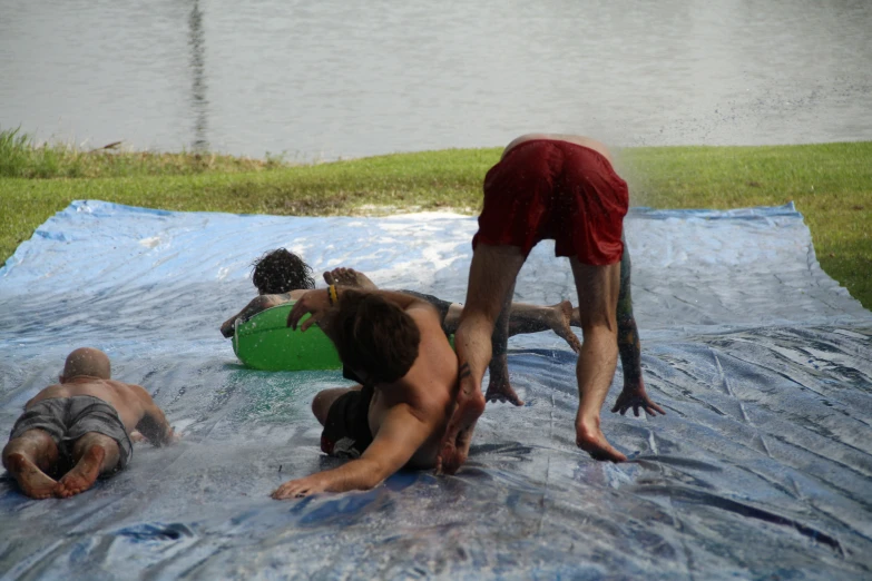two men are trying to dry off in a large pool