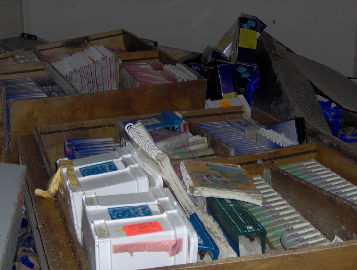 a drawer filled with papers and some folders