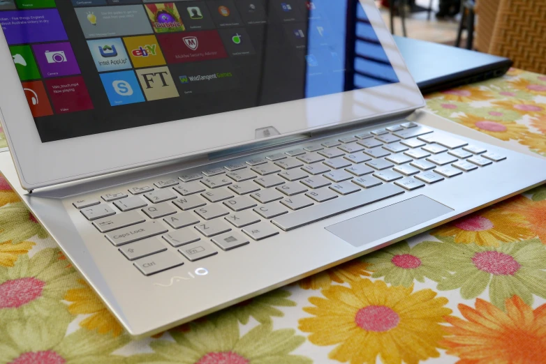 a close up view of a laptop computer with its keyboard and windows logo on it