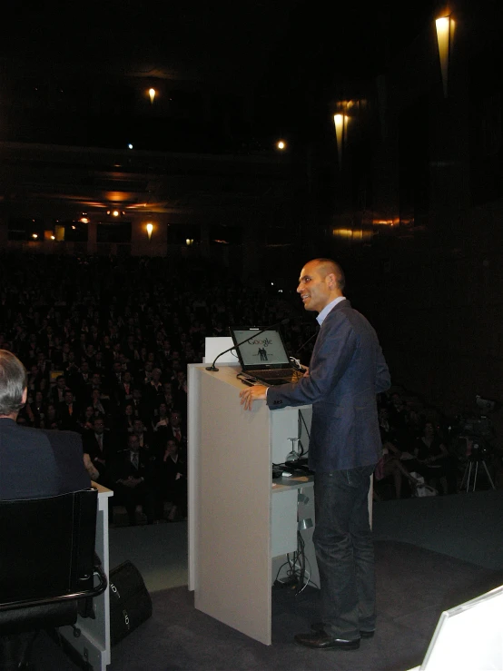 the man in the suit is operating his computer