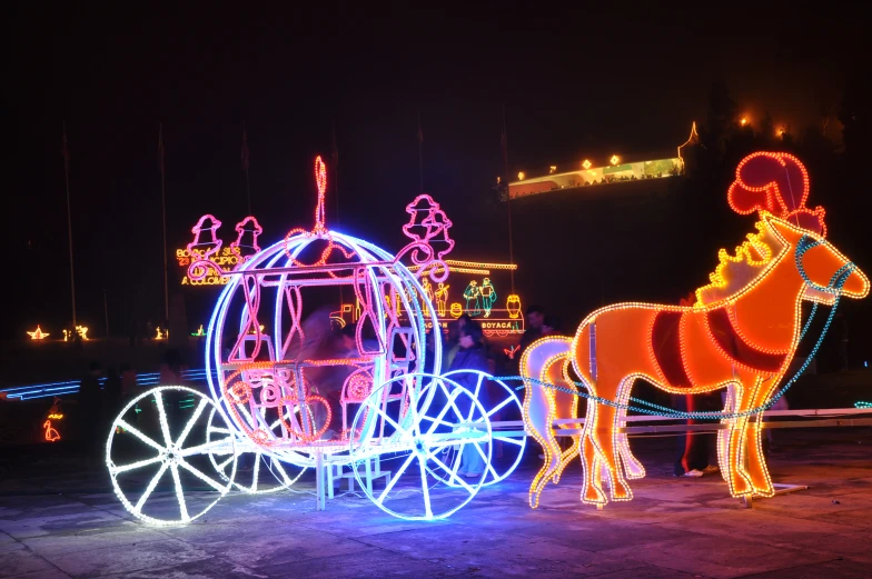 two horse and buggies with neon lights