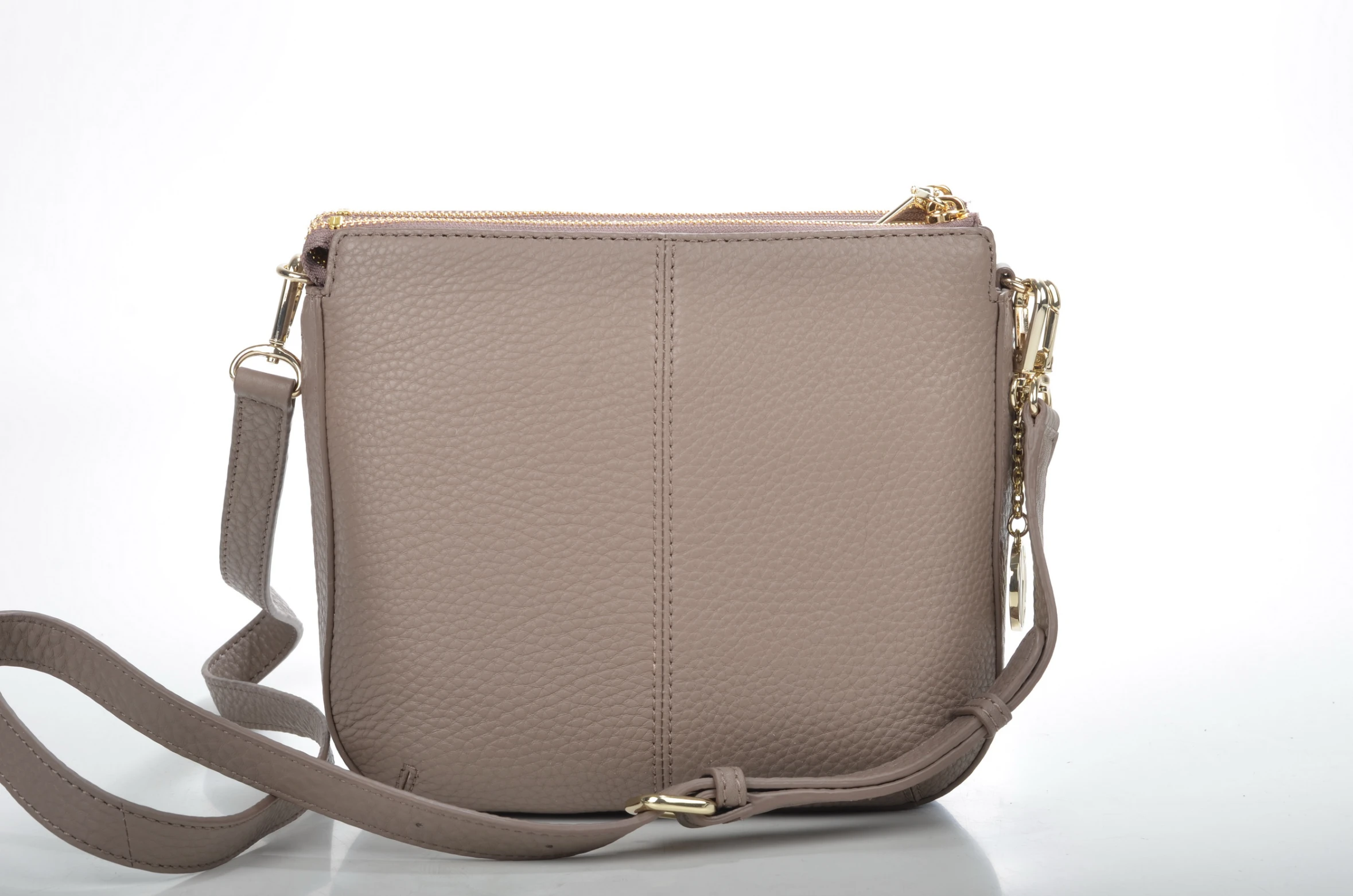 the beige cross body bag on white