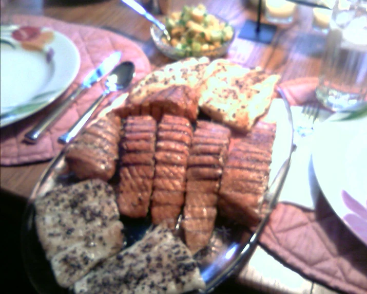 a variety of food sitting on top of plates