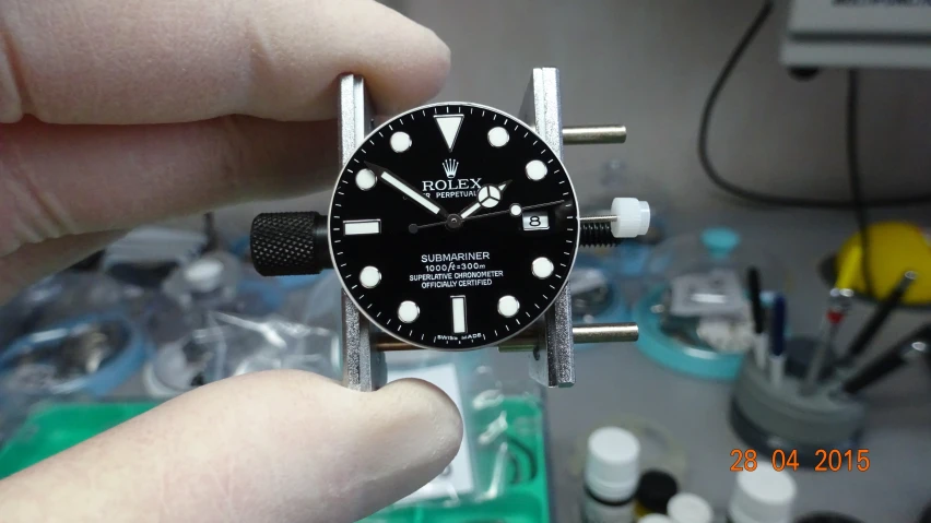 a watch being held in someone's hand