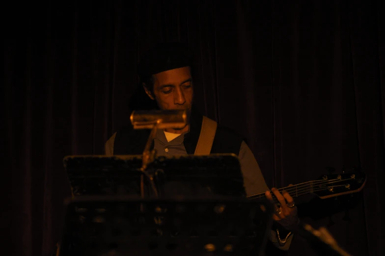 a person standing in front of a sound board and an instrument