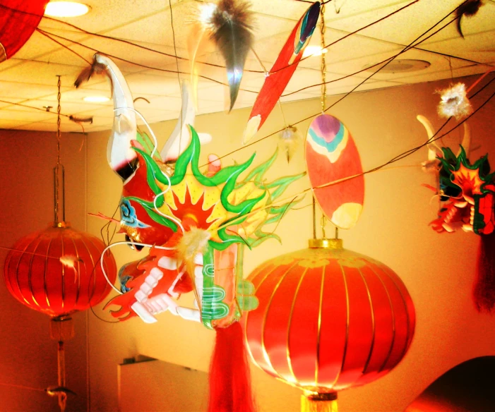 oriental lanterns hanging from wires in an office building