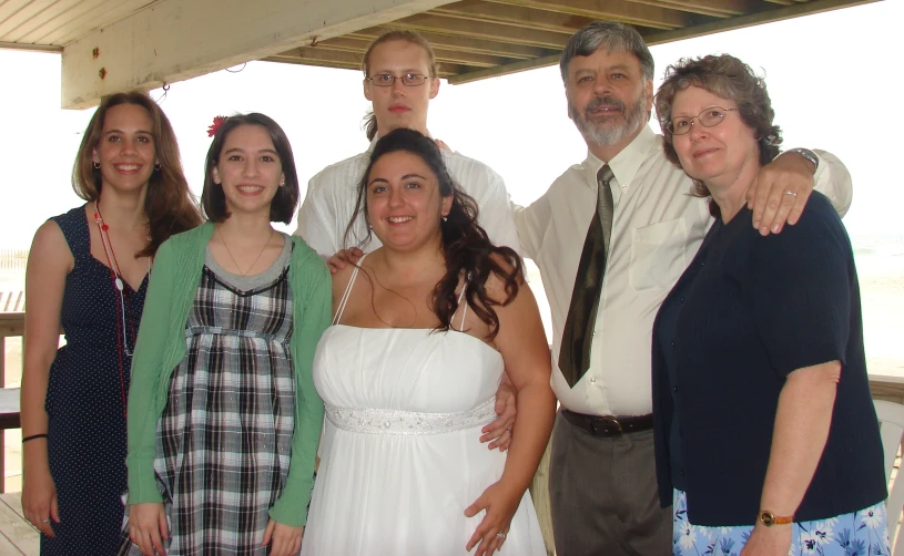 a group of people in front of a body of water