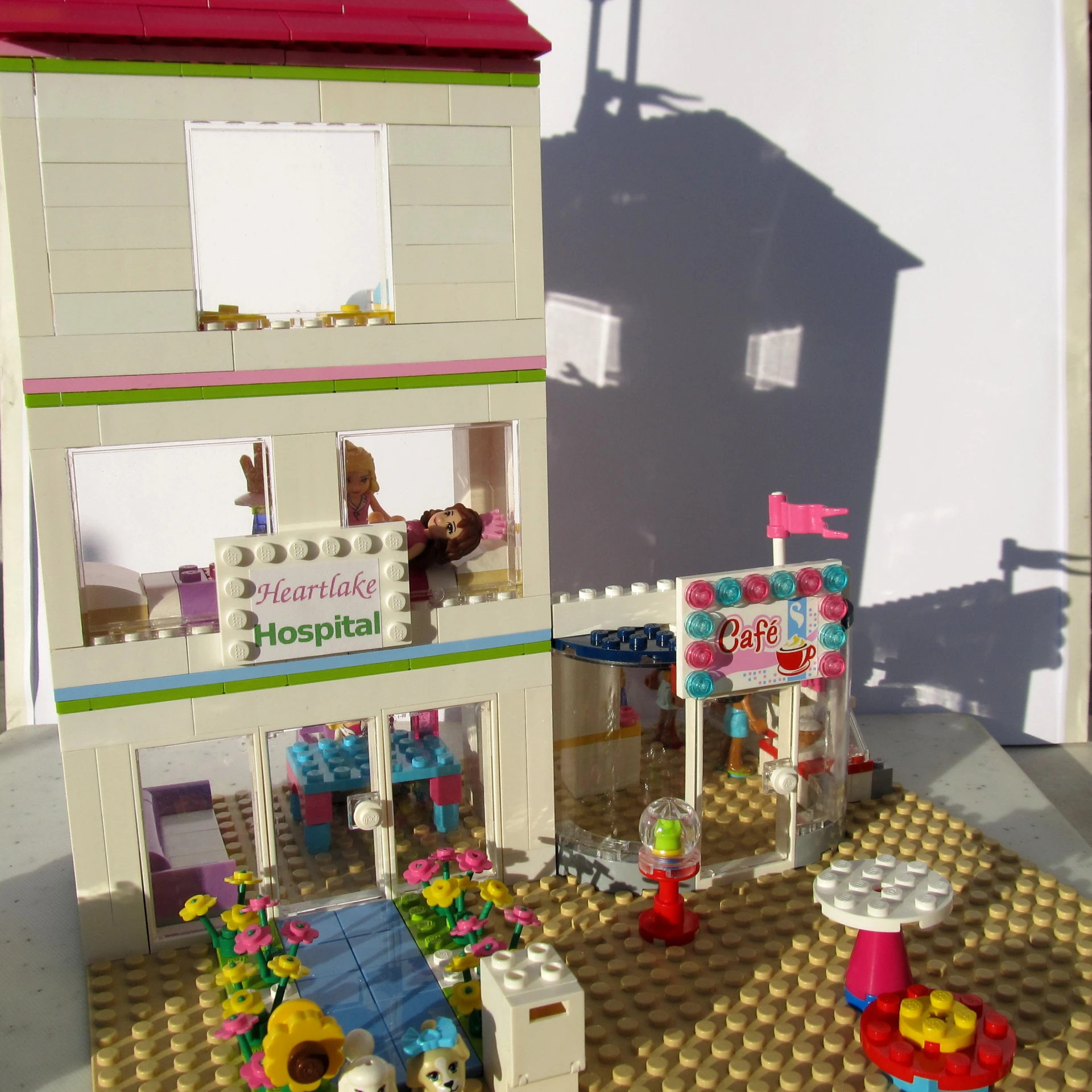 a lego house with a teddy bear in the front