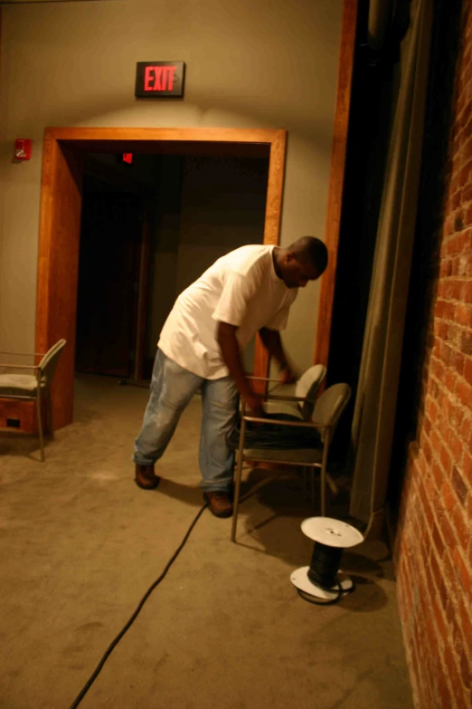 a man is cleaning up the floor with a high pressure pump