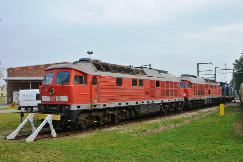 an old style train on the railroad tracks