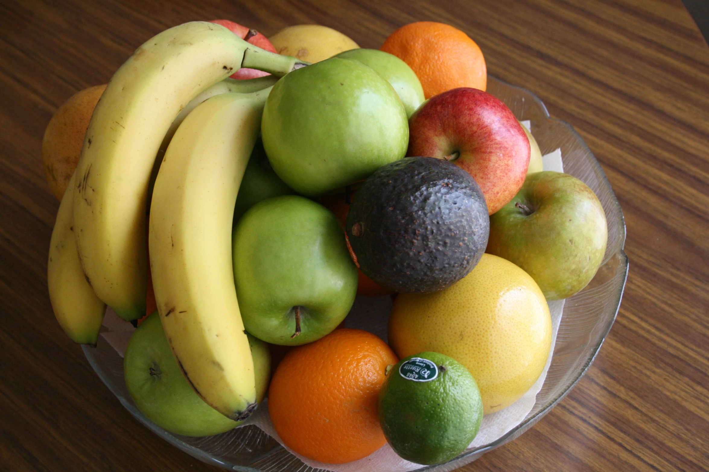 a close up of a glass plate with fruit