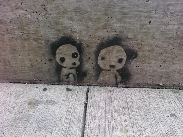 graffiti drawings of a couple of stuffed animals