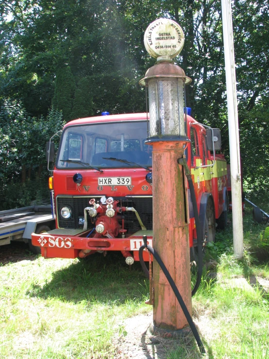 the tow truck is parked next to a fire hydrant