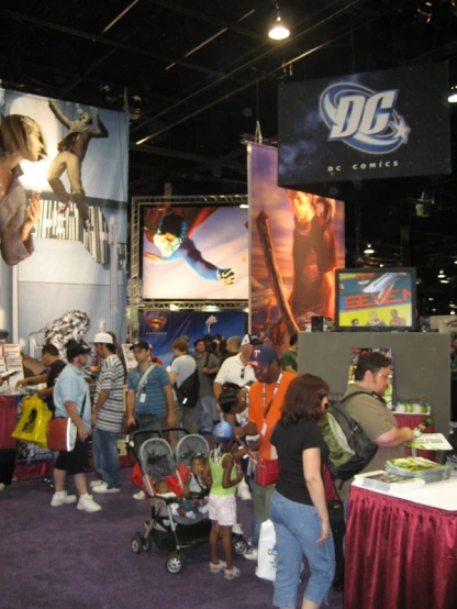 group of people in museum standing around a show booth