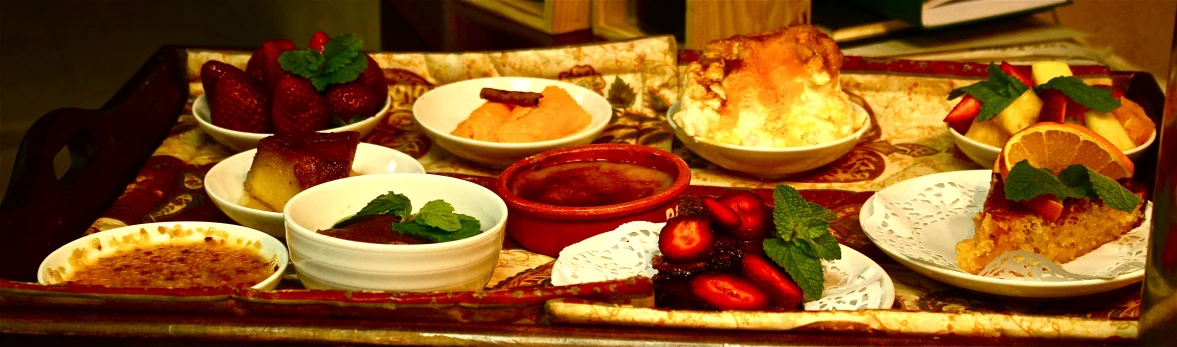 a wooden tray filled with bowls of food