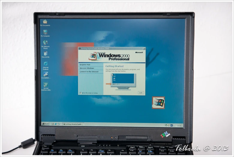 a windows xp home screen is being displayed on a laptop