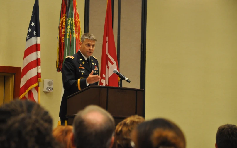 a man in a uniform giving a speech