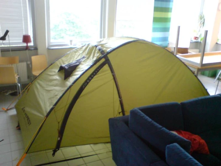 a couple of tents that are next to a window