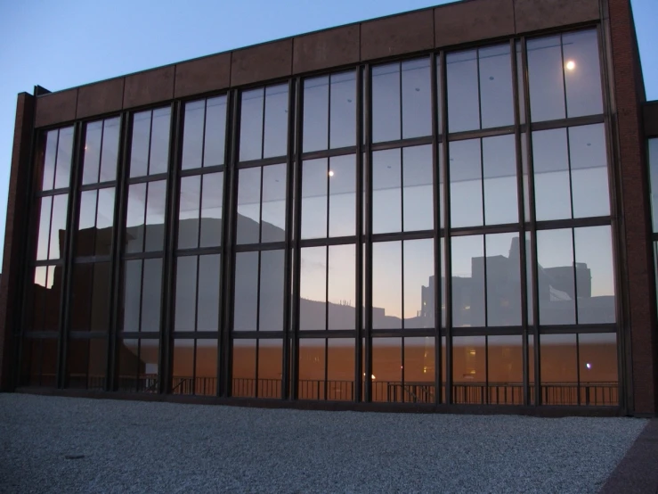 an old factory building with several large windows