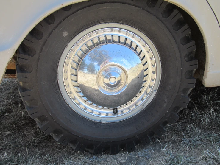 the wheel is shown on an old white truck