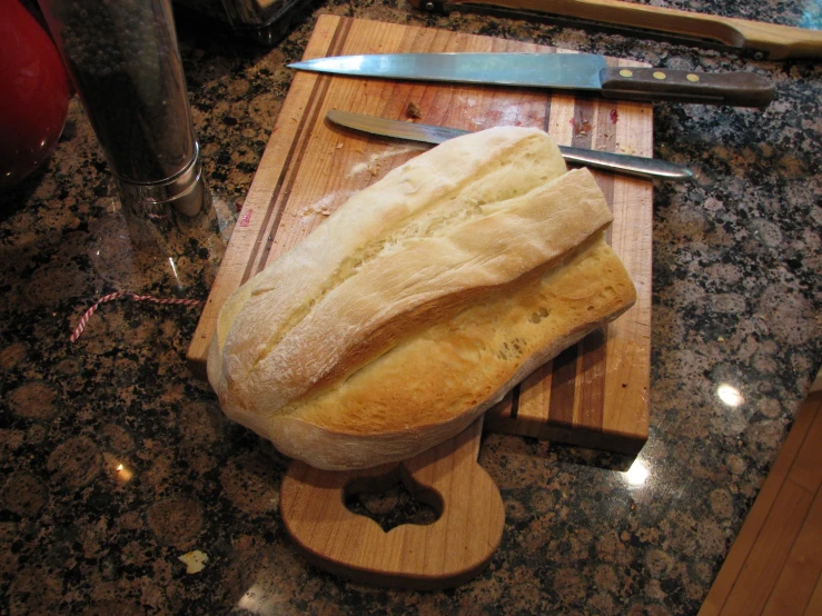 bread is prepared on the  board for consumption