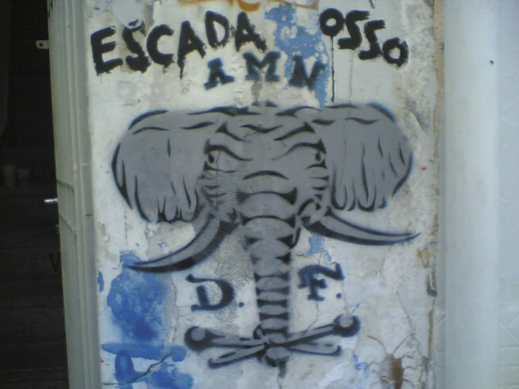 graffiti painted on the side of a door with an elephant head