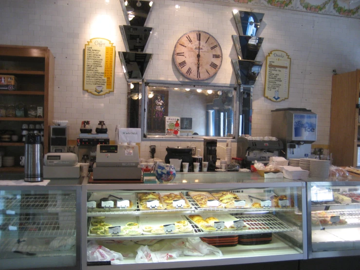 an open bakery display case filled with food