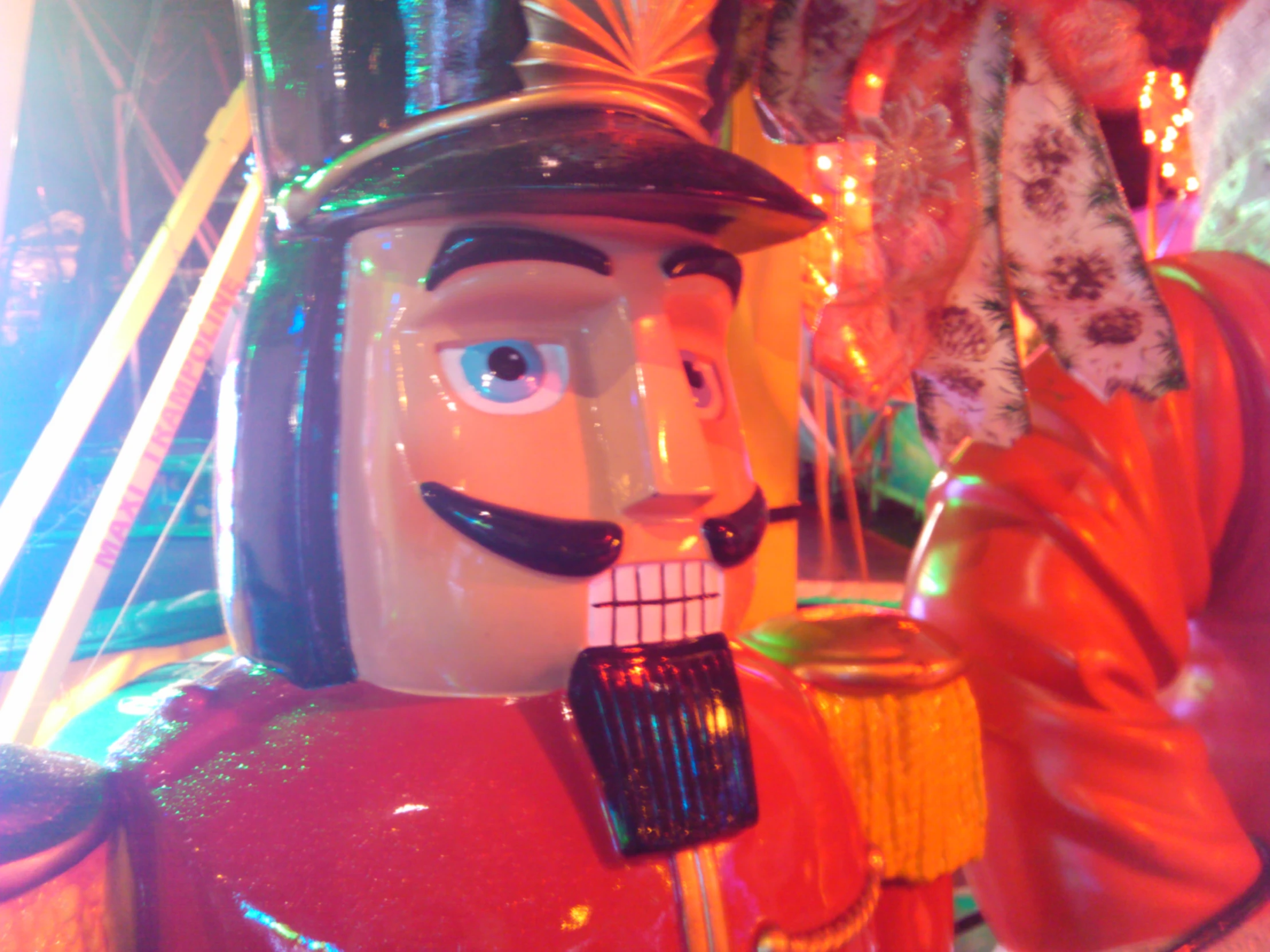 a close up s of a toy soldier wearing a hat and a moustache