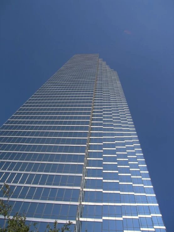 looking up at the top of a skyscr from ground level