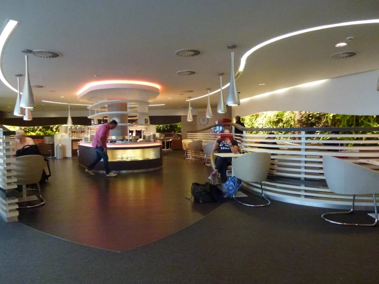 a large restaurant area with tables and chairs