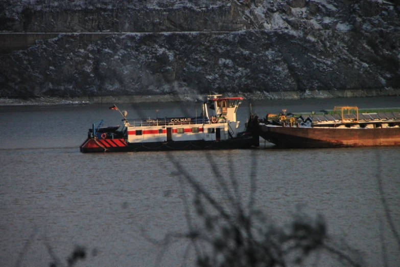 two boats in the water near one another