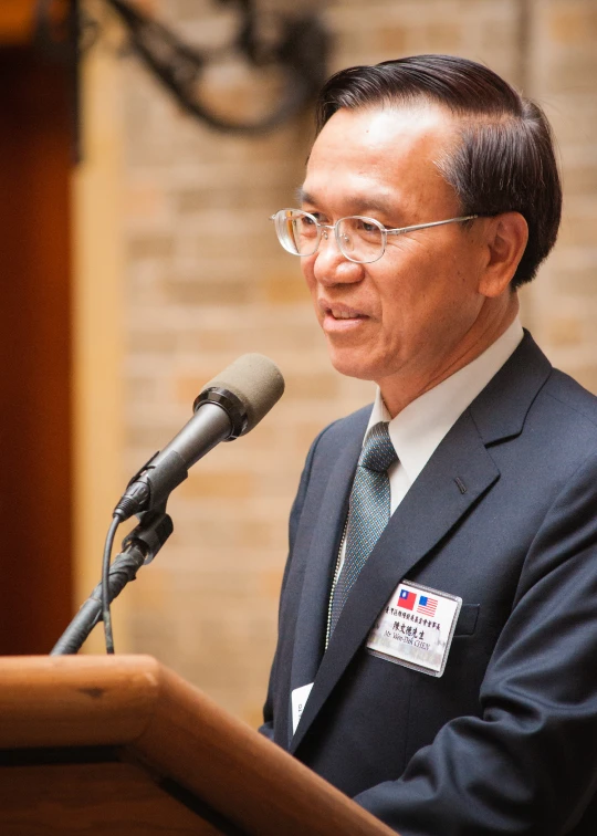 a man standing in front of a microphone