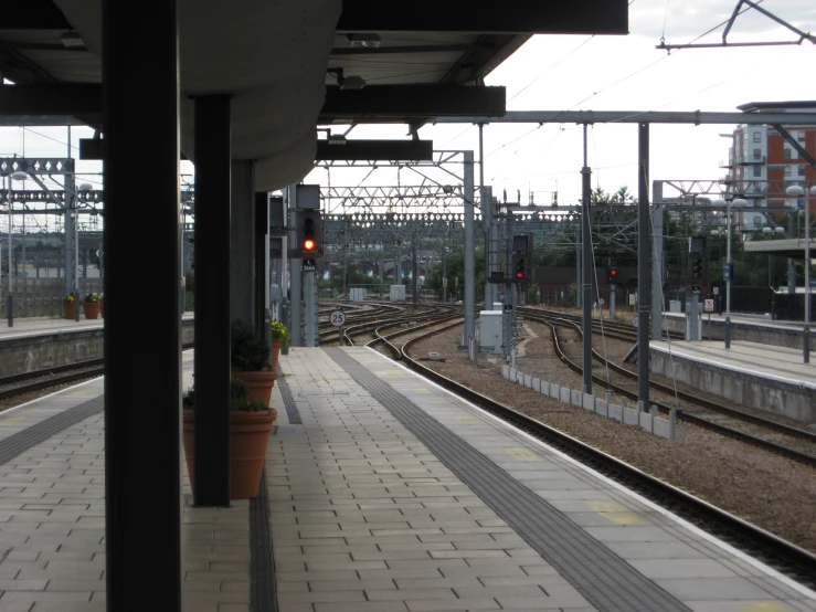 a train coming into the station in the early evening