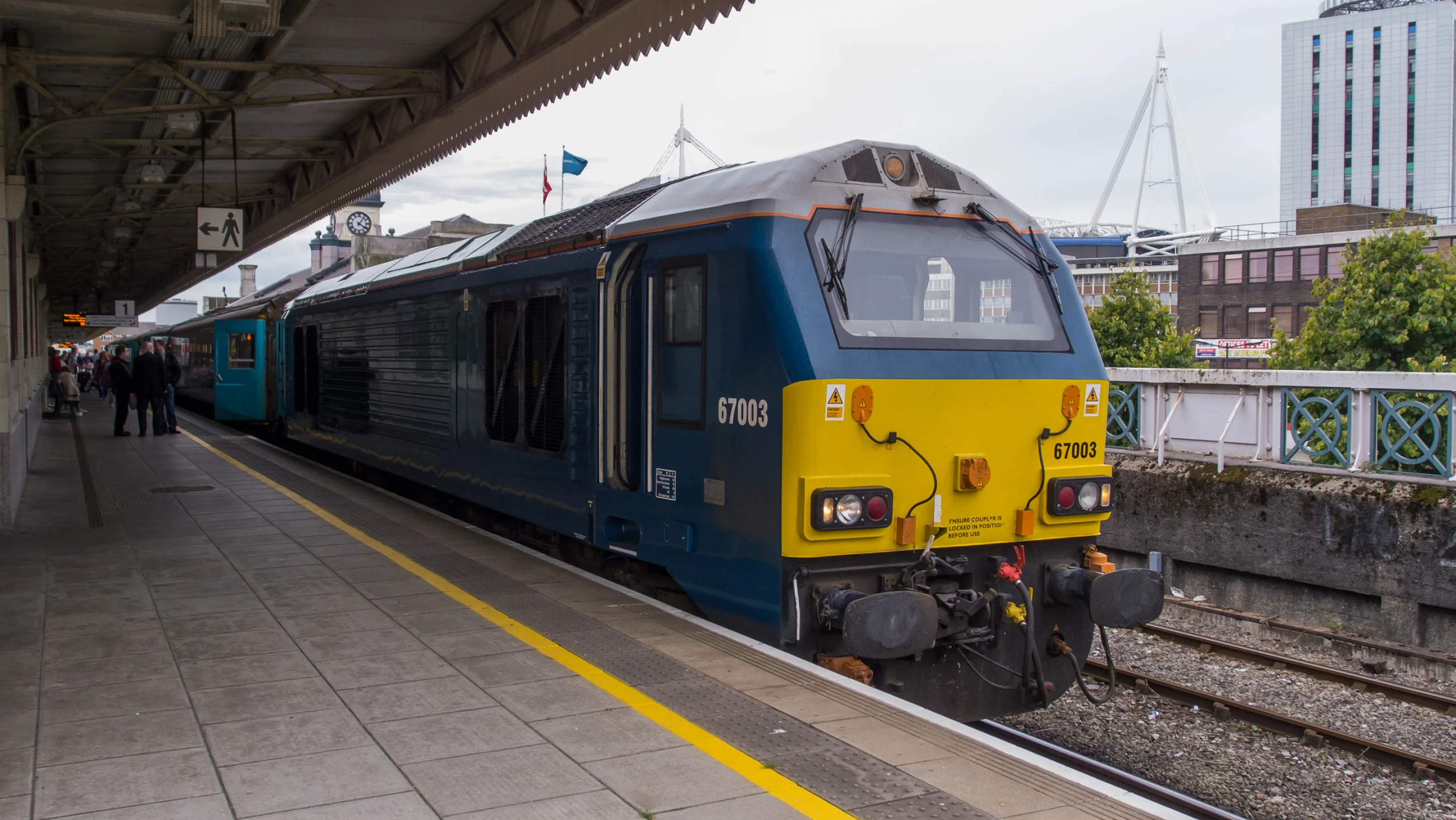 a train stopped at the platform for passengers to board