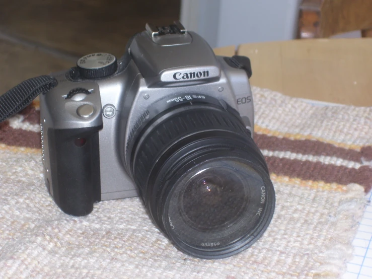 a camera sitting on top of a table with an object around it