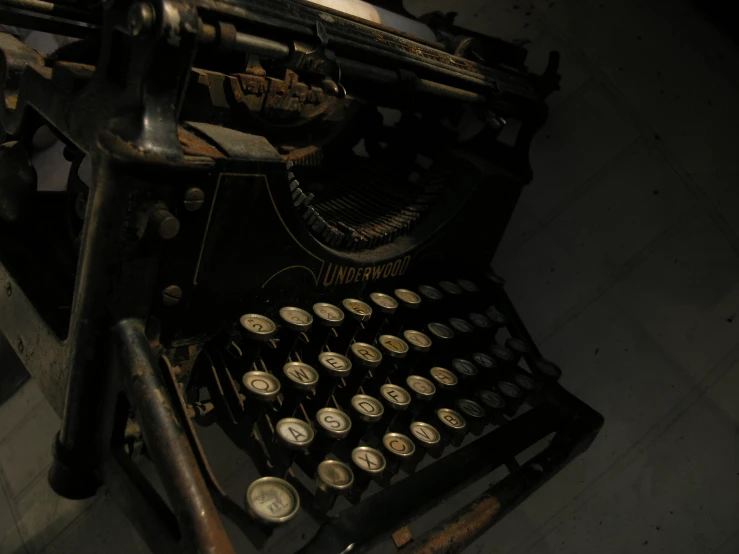 an old typewriter set up in the dark
